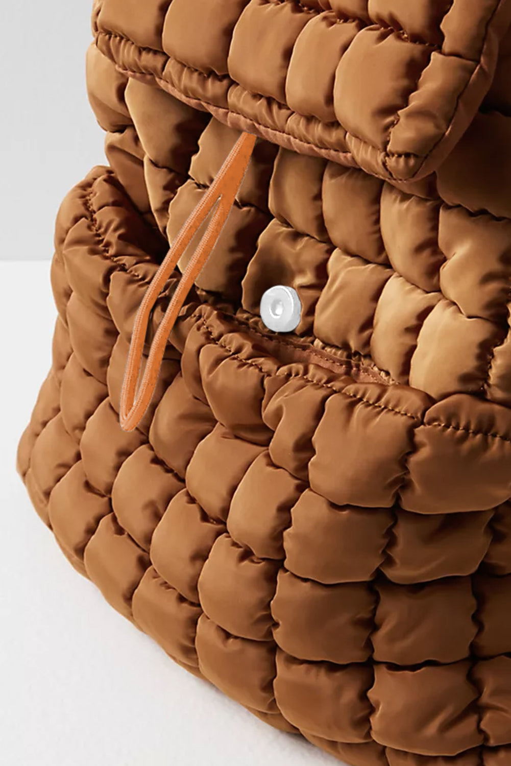 Close up of a Chic coffee brown Quilted Puffer Flap Backpack 