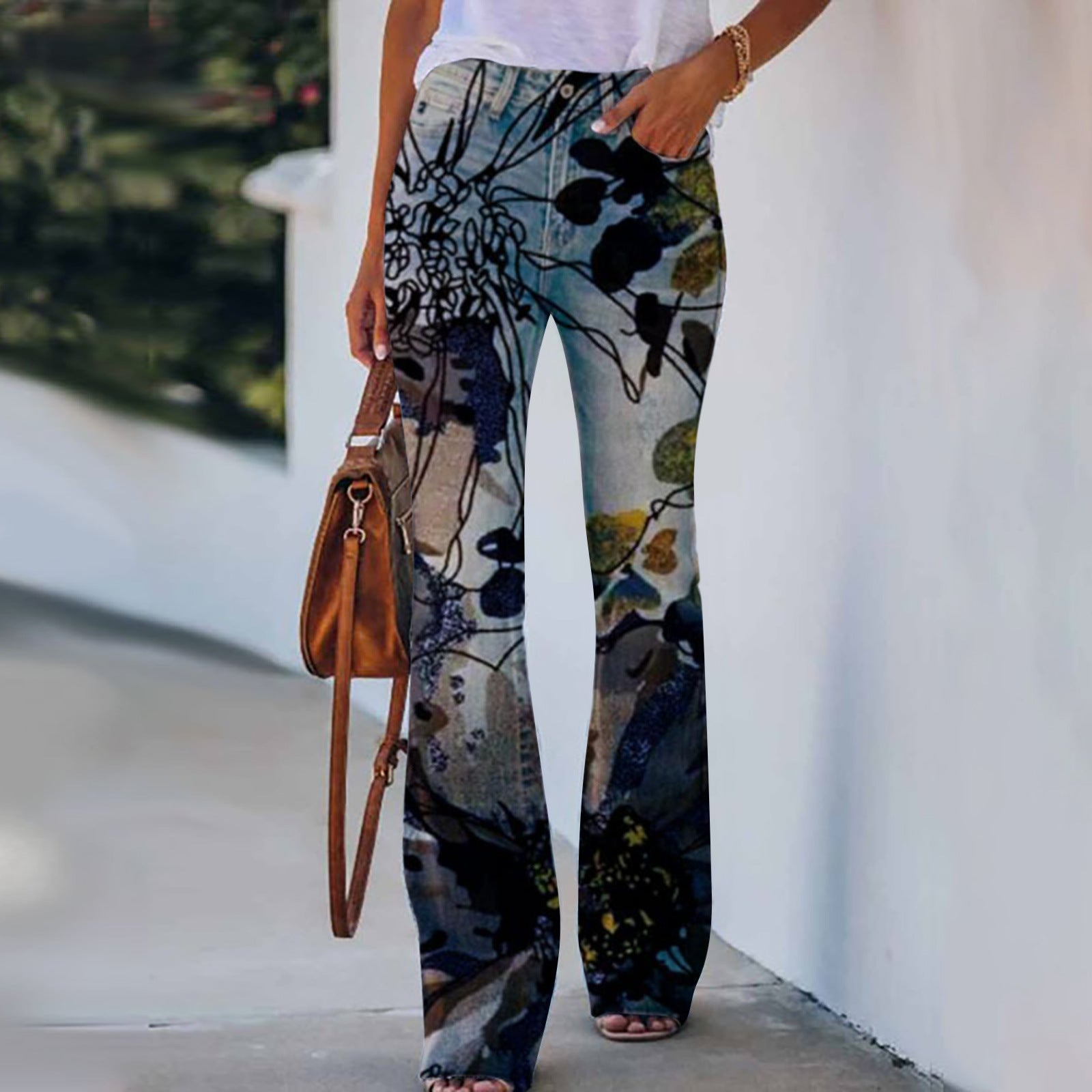 Add a splash of color and nature to your wardrobe with our Women's Summer Flower-bird Print Trousers. These vibrant trousers feature a unique print of flowers and birds, perfect for brightening up any summer outfit. Stay stylish and comfortable all season long.