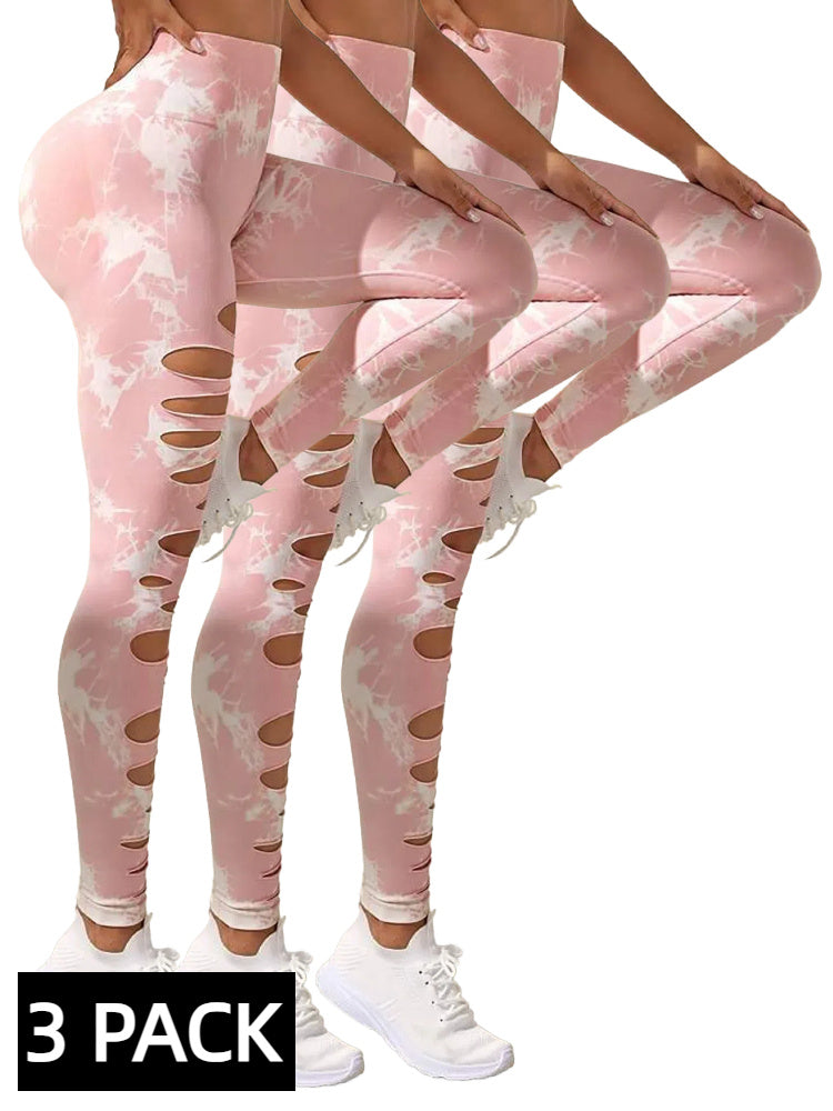 Three pairs of pink leggings with cut-out design on a white background