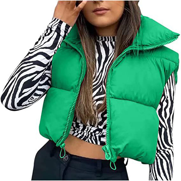 Green puffer vest worn by a person with zebra print sleeves.