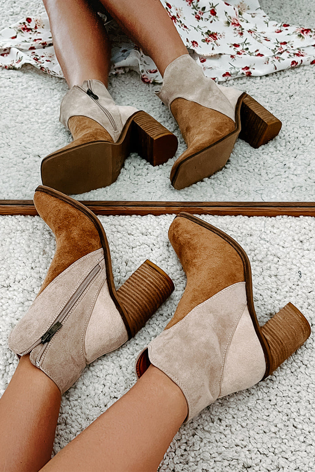 Pair of brown and beige ankle boots side view