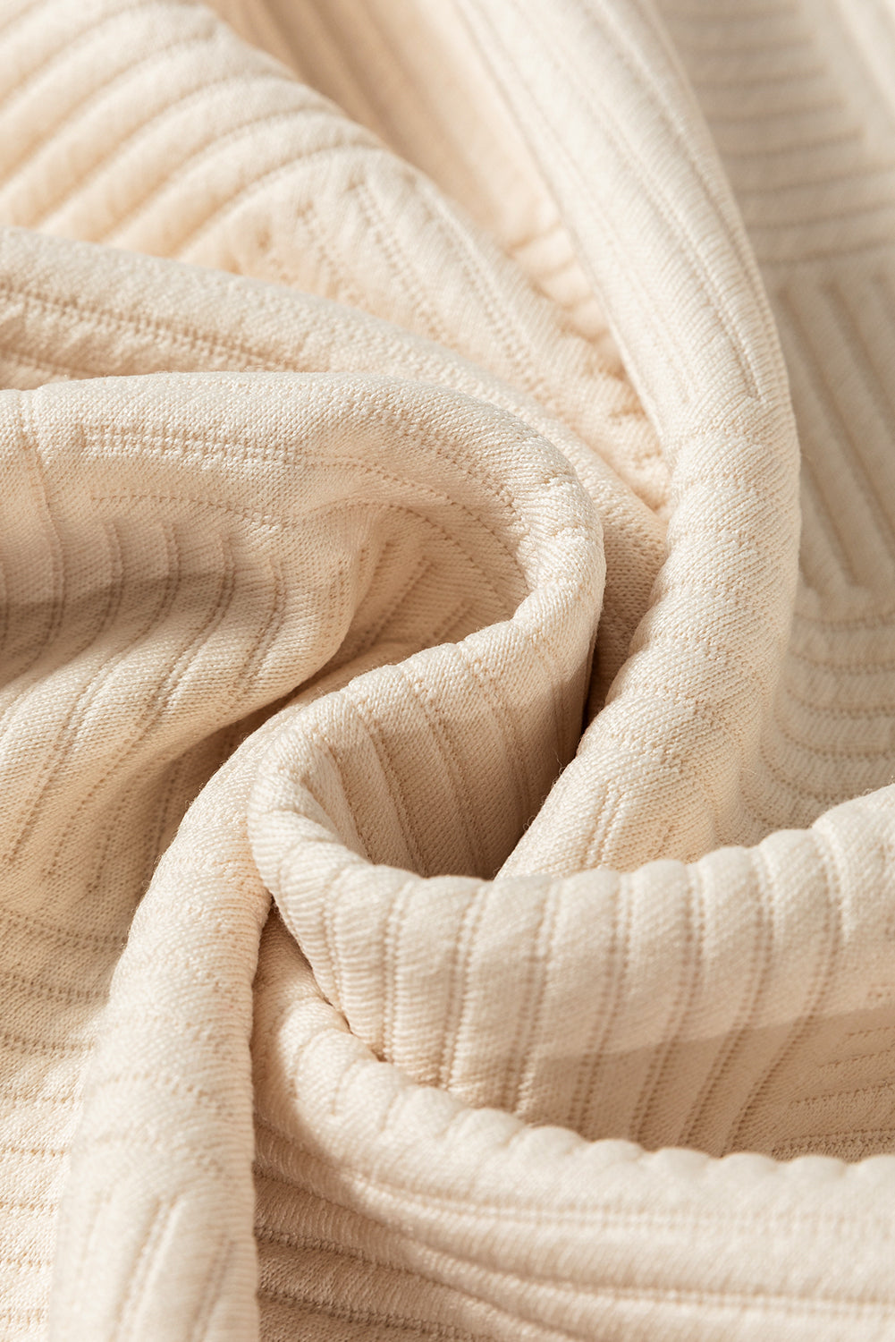 Close-up of beige textured fabric