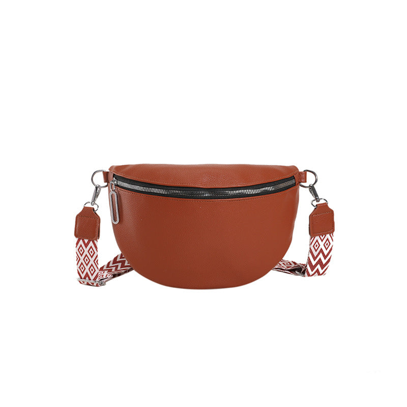 Brown round bag with a decorative strap on a white background
