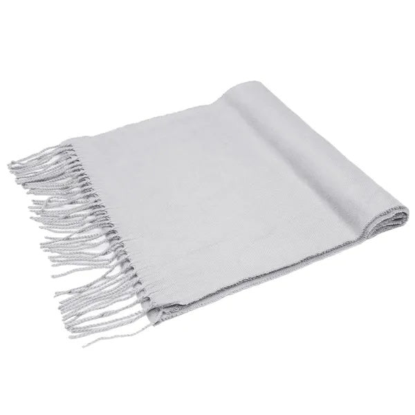 Gray throw blanket with fringes on a white background