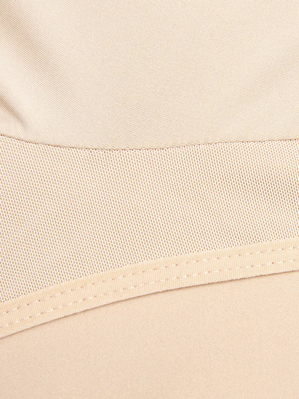 Close-up of beige fabric with a woven pattern