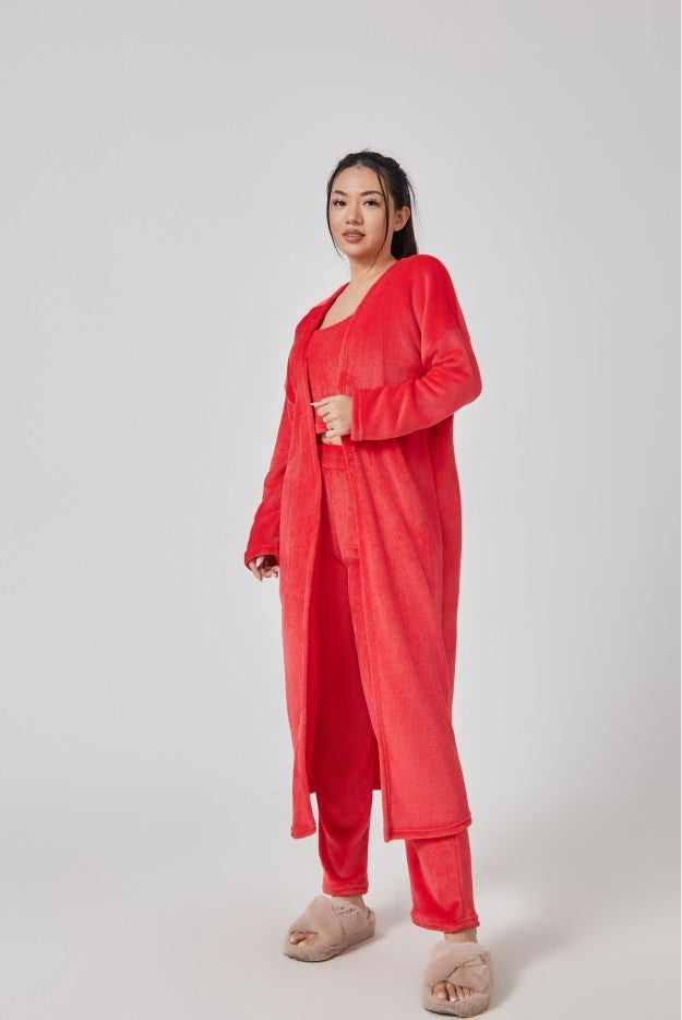 Woman wearing a red outfit on a white background