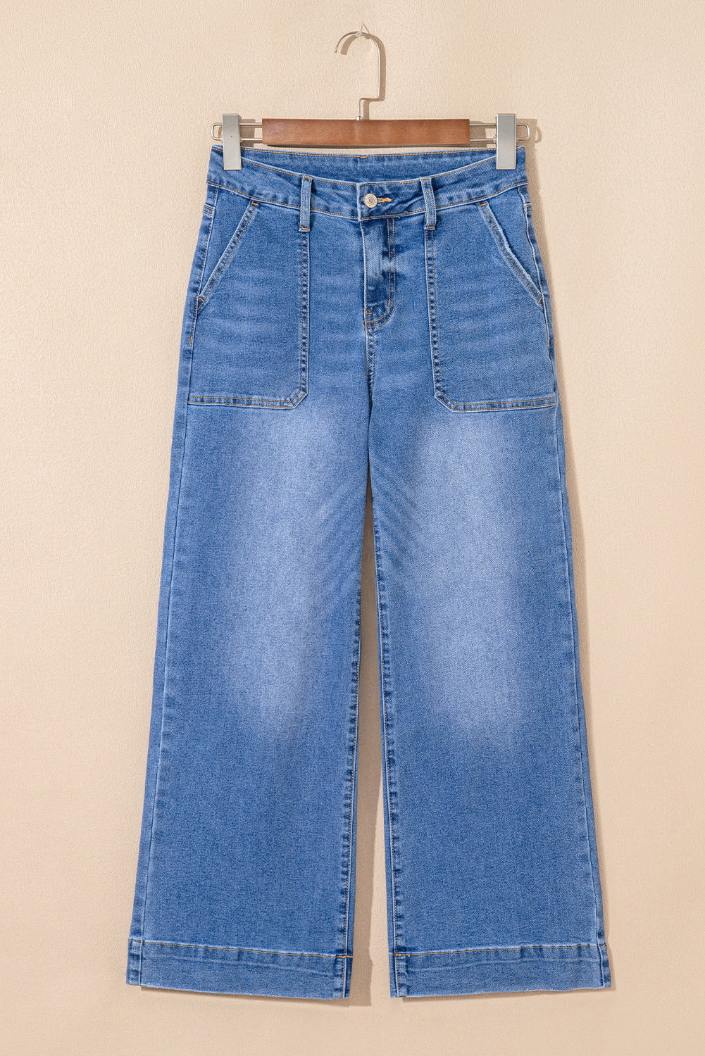 Blue jeans on a beige background