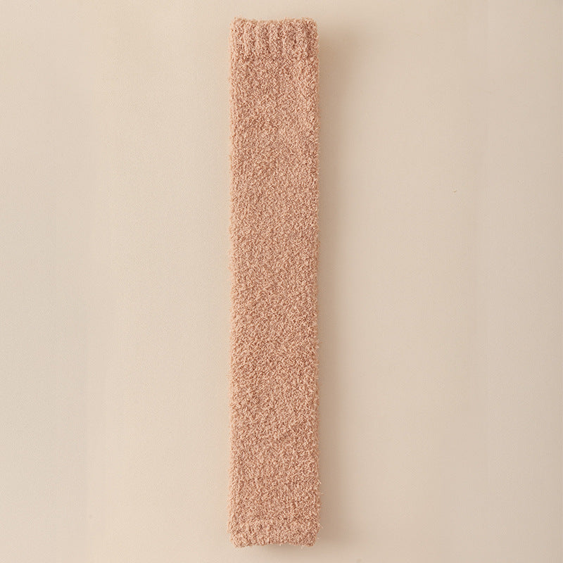 Long, rectangular, textured pink object on a beige background