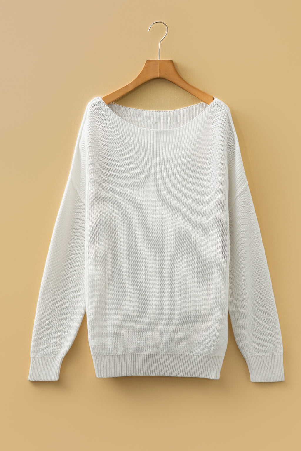 Front white Asymmetric Neck Drop Shoulder Baggy Sweater on a wooden hanger.