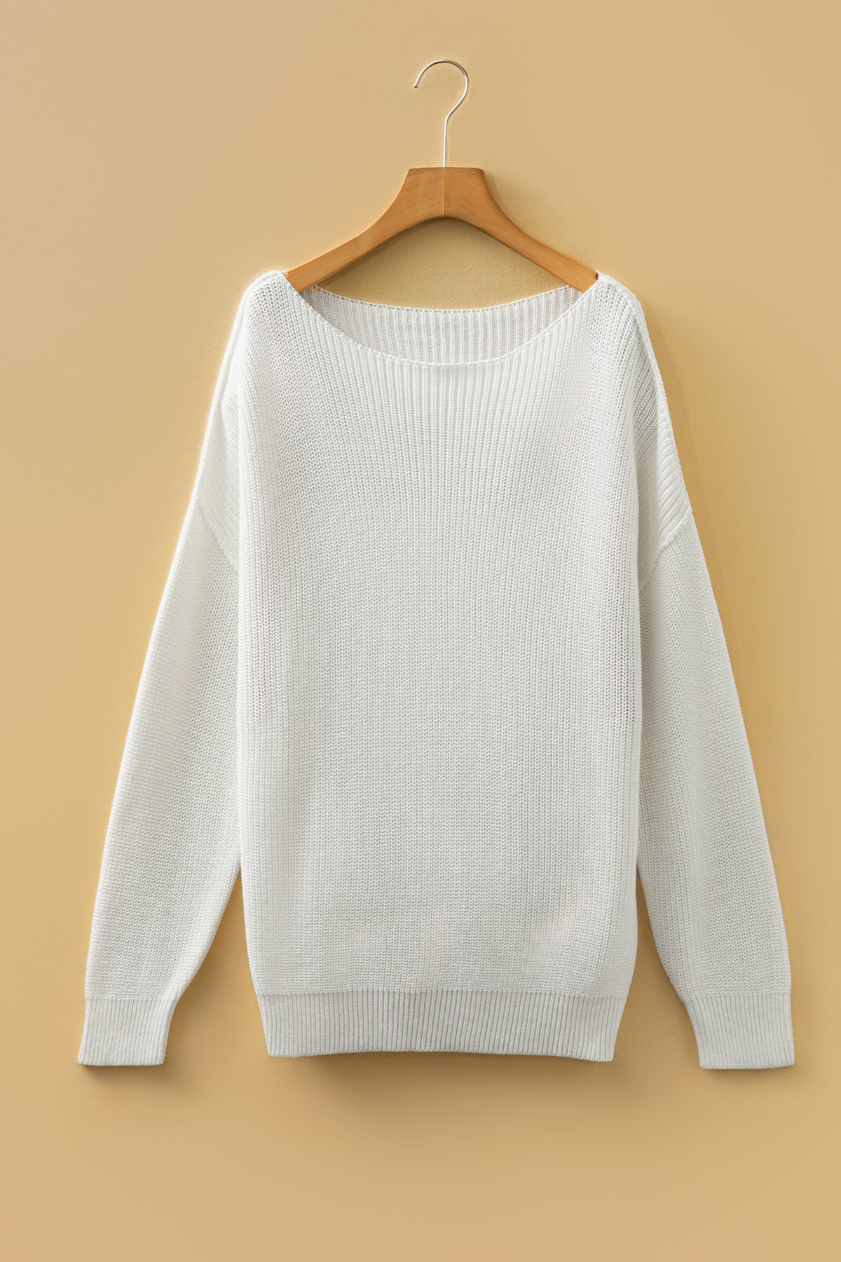Front white Asymmetric Neck Drop Shoulder Baggy Sweater on a wooden hanger.
