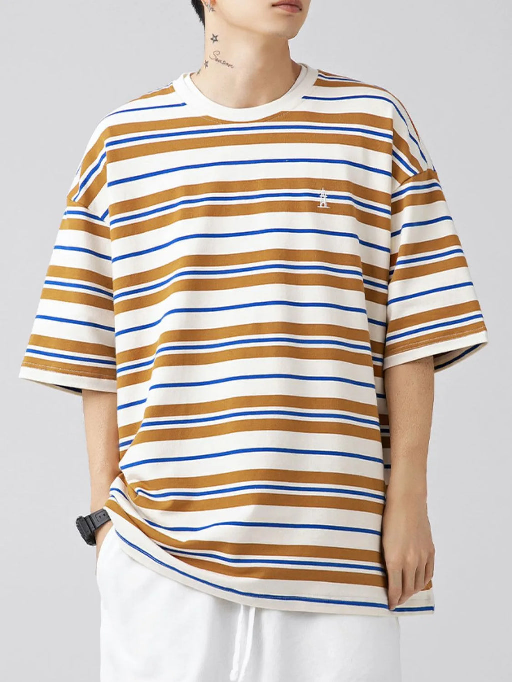 Male model wearing a camel brown urban short sleeve stripe t-shirt