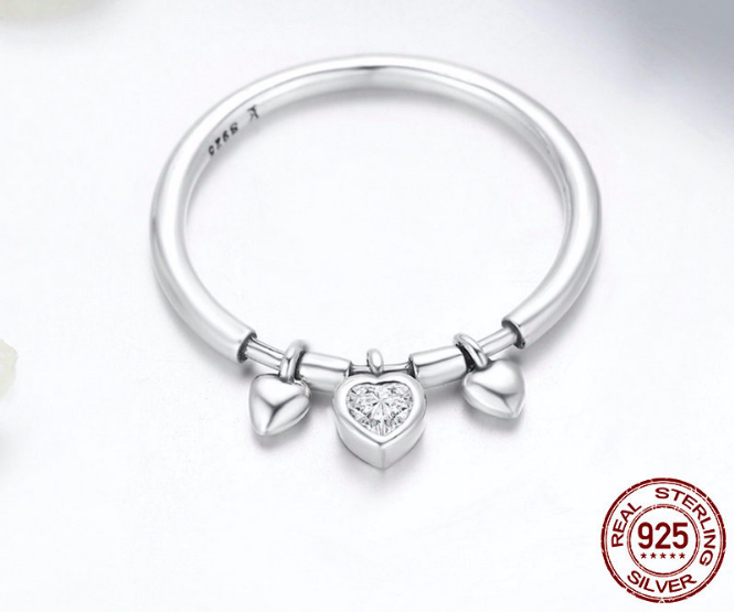 Experience pure elegance with our .925 sterling silver Heart Pendant Ring. This stunning piece is crafted with the highest quality silver, making it durable for everyday wear. Let the intricate heart design add a touch of dazzle to your outfit, perfect for any occasion