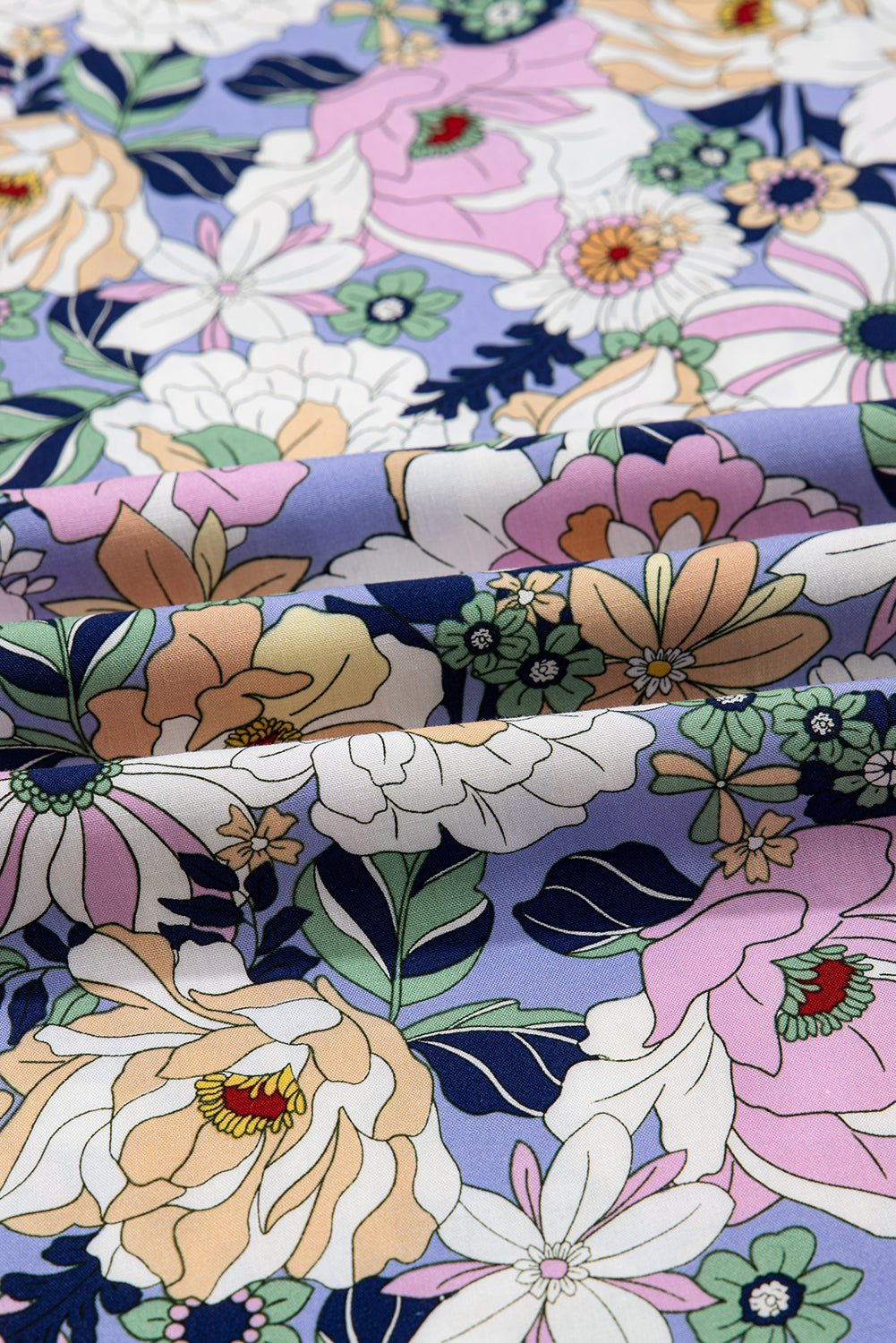 Floral fabric pattern with colorful flowers on a blue background