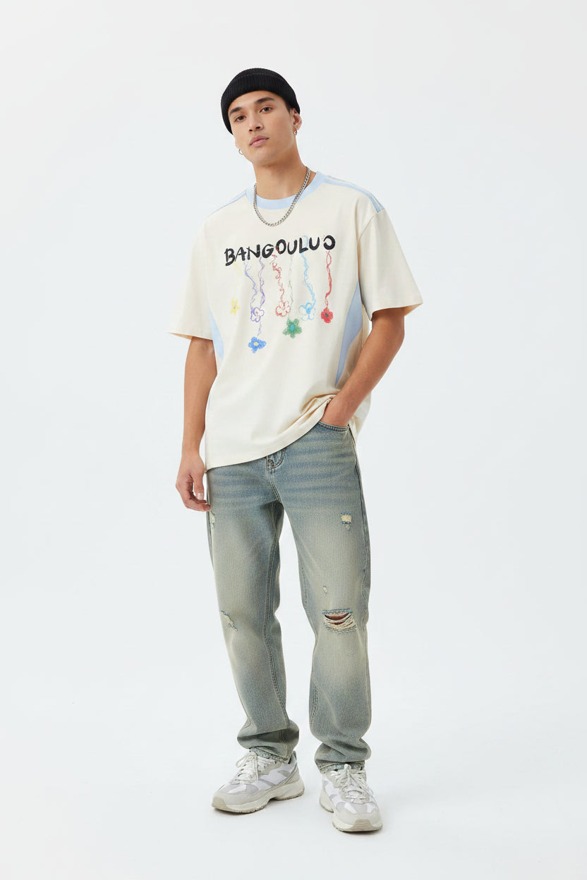 Male model wearing an apricot "Bangouluo" Graphic Short Sleeve T-Shirt