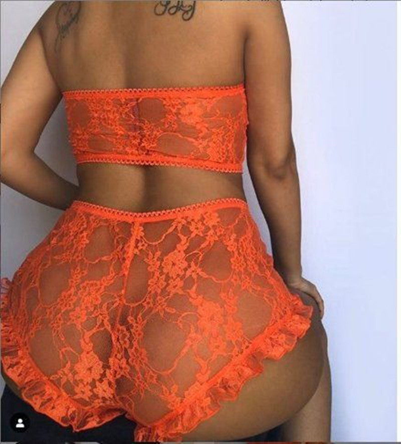 Orange lace lingerie set on a plain background