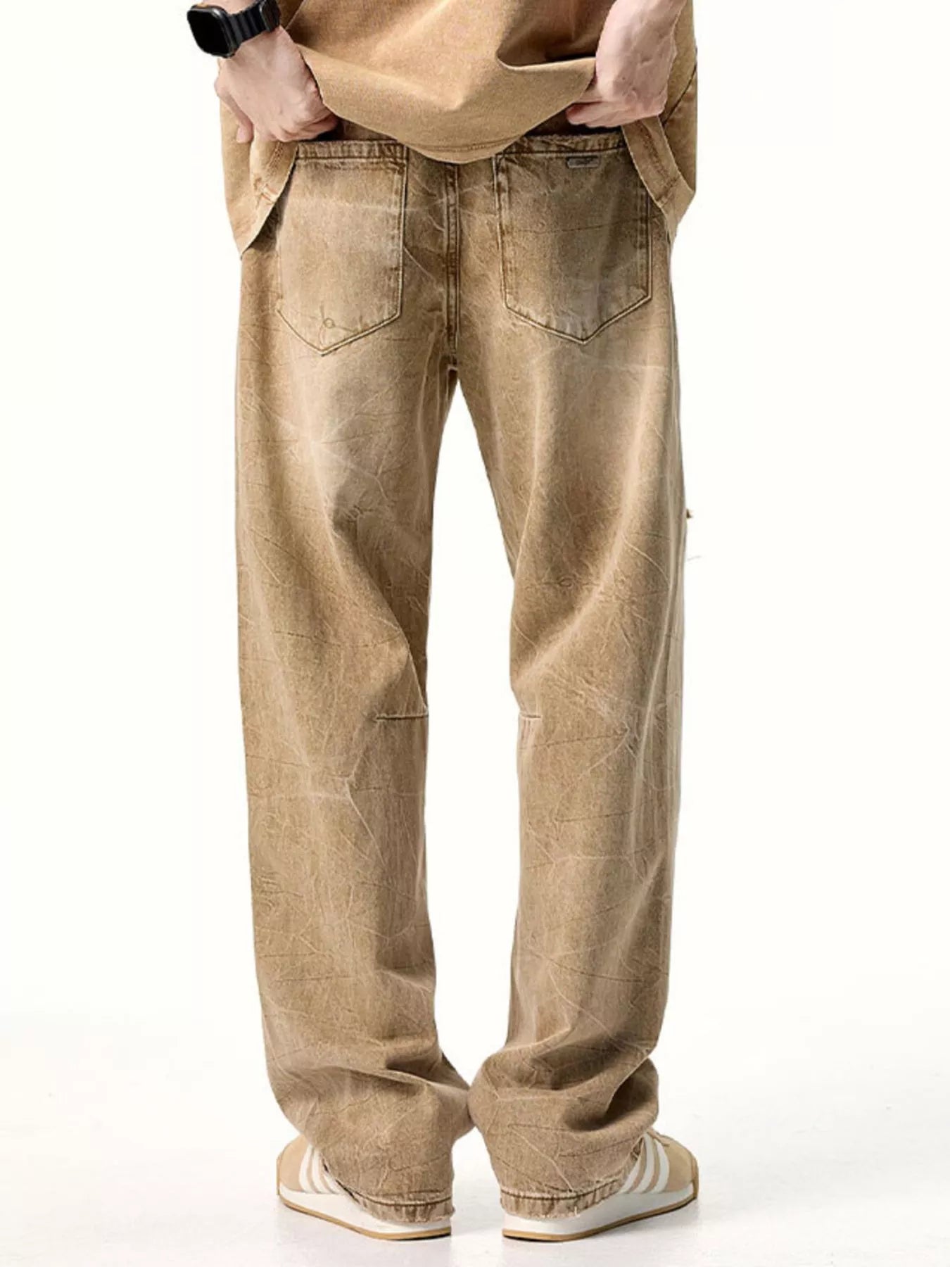 Male model wearing a pair of Men's Camel Brown Distressed Relaxed Fit Jeans back view