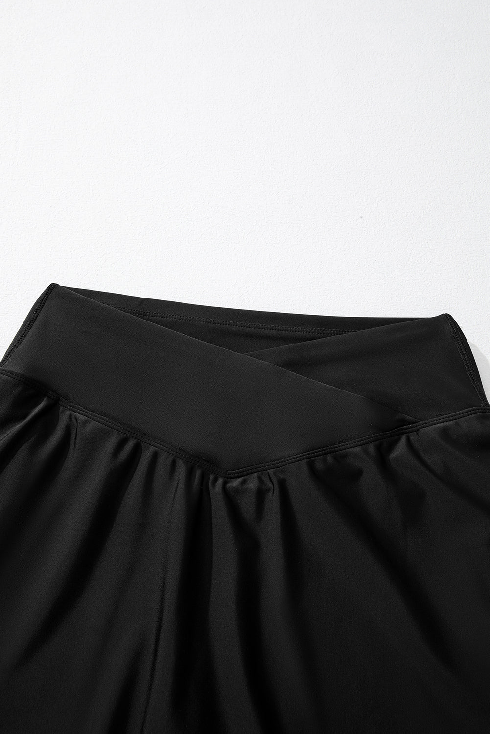 Close-up of a black skirt on a white background
