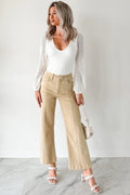 Model wearing a white top, Apricot Women's Center Seam Cropped Jeans, and white sandals.