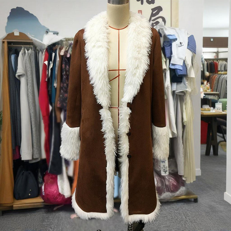 Brown coat with white fur trim on a mannequin against a clothing store background