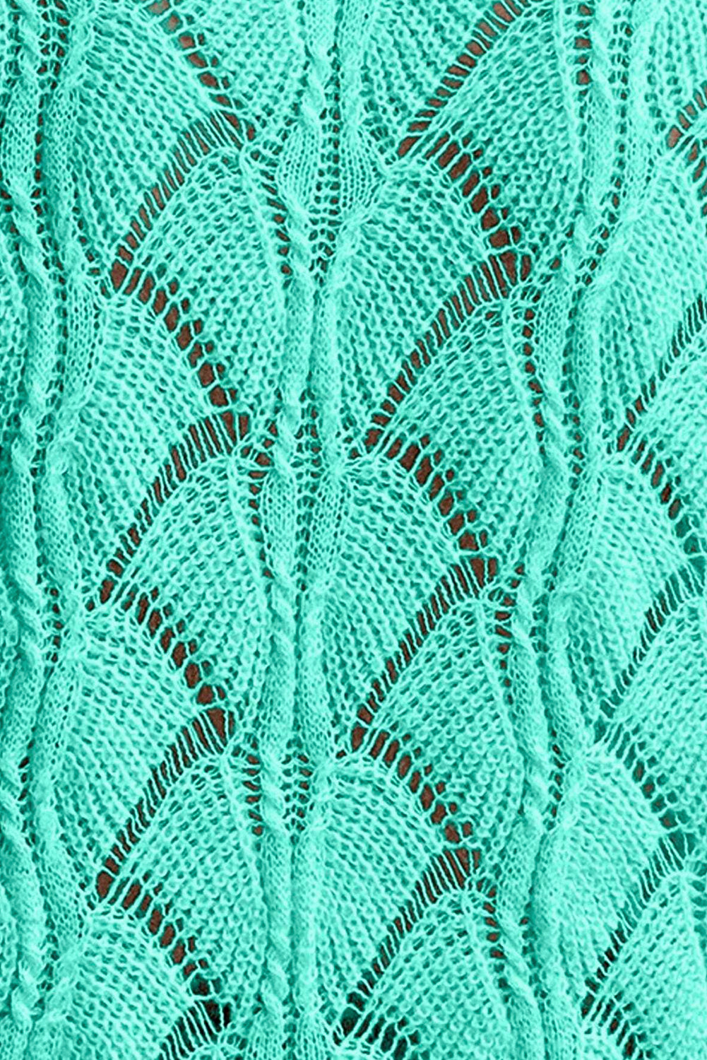 Close-up of a teal knitted fabric with a diamond pattern
