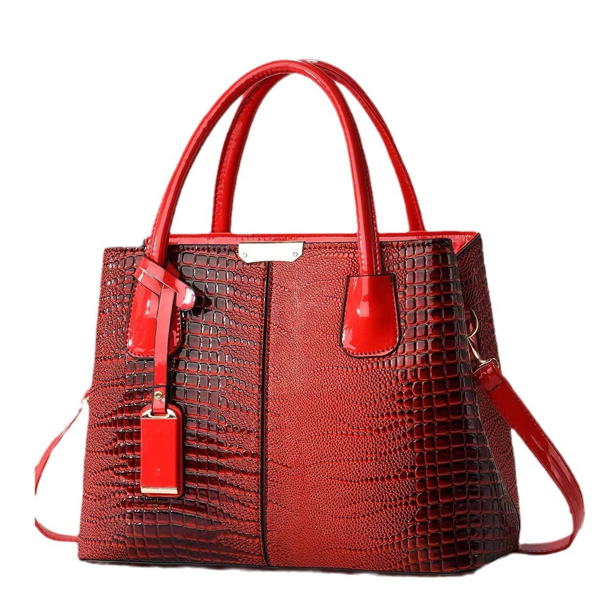 Red textured handbag with matching strap on a white background