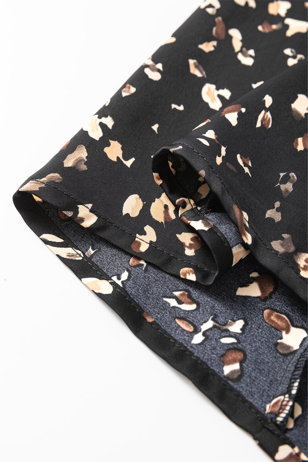 Folded fabric with a floral pattern on a black background
