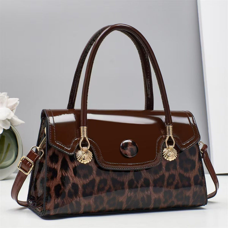 Brown handbag with leopard print pattern on a light gray background