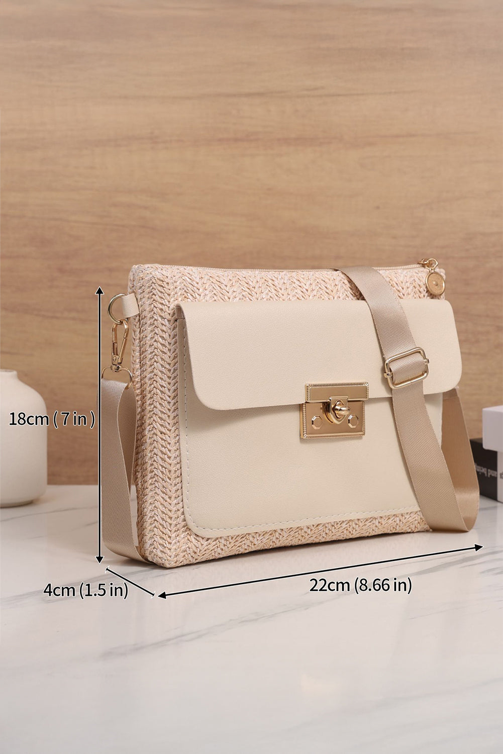 Beige handbag with measurements on a wooden surface 7inx1.5inx8.66