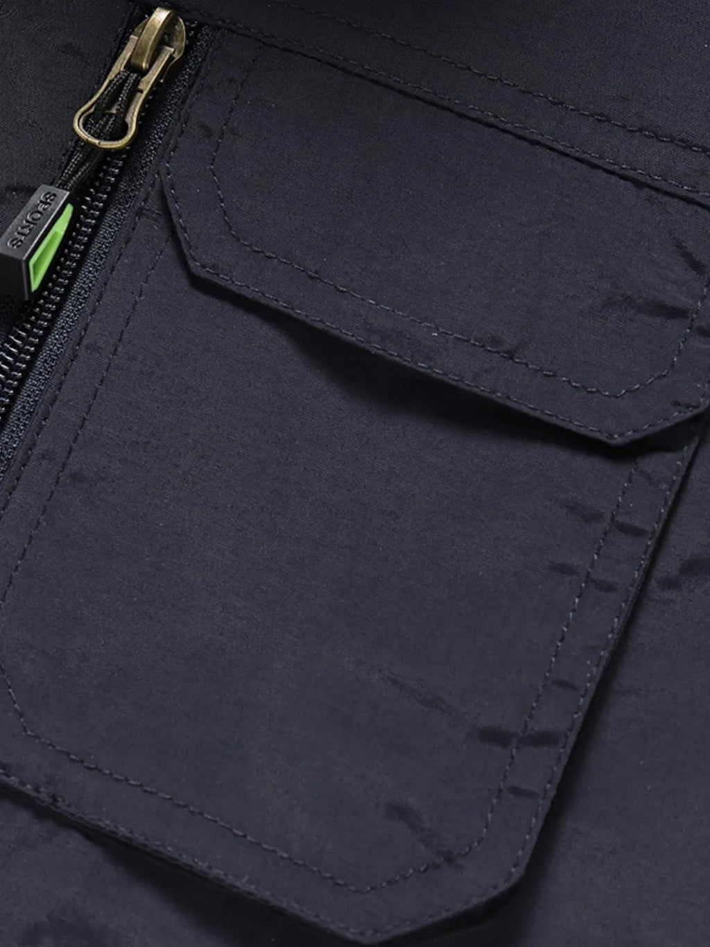 Close-up of a navy blue Men's Fisherman Style Zip Up Vest pocket with a zipper.