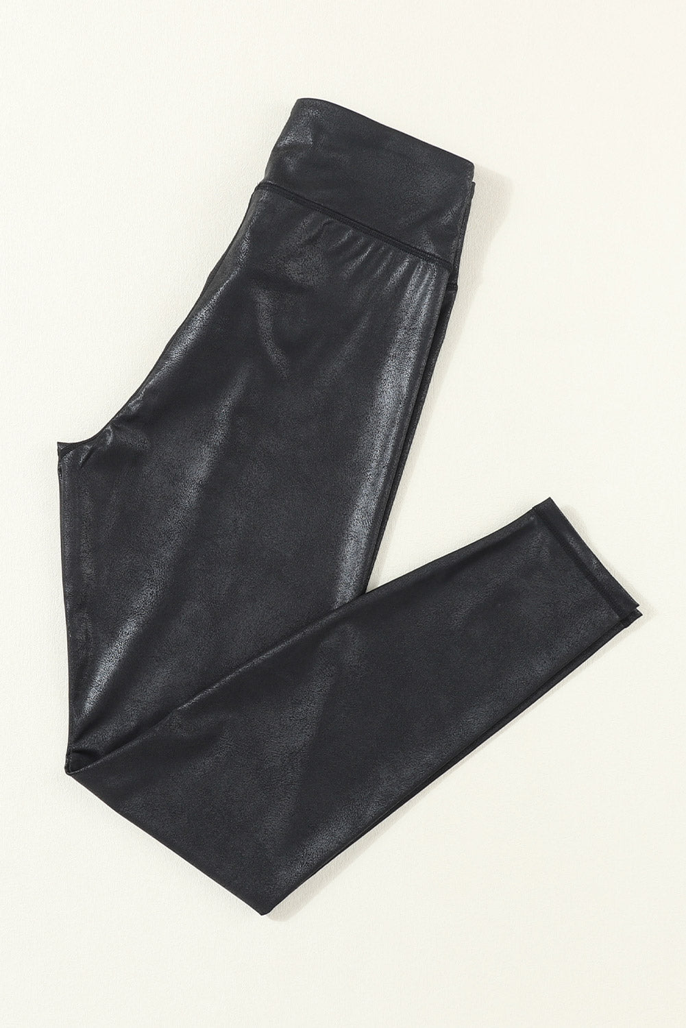 Black leather pants on a white background