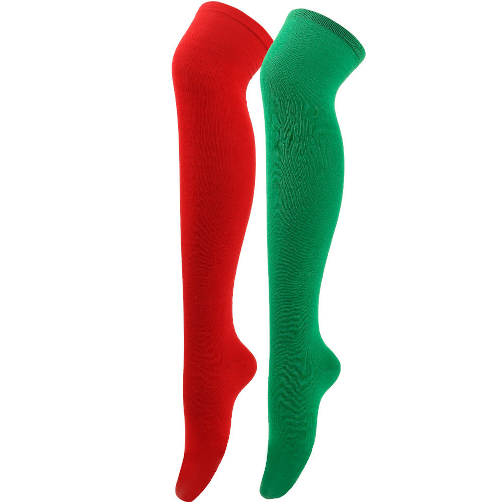 Red and green knee-high socks on a white background
