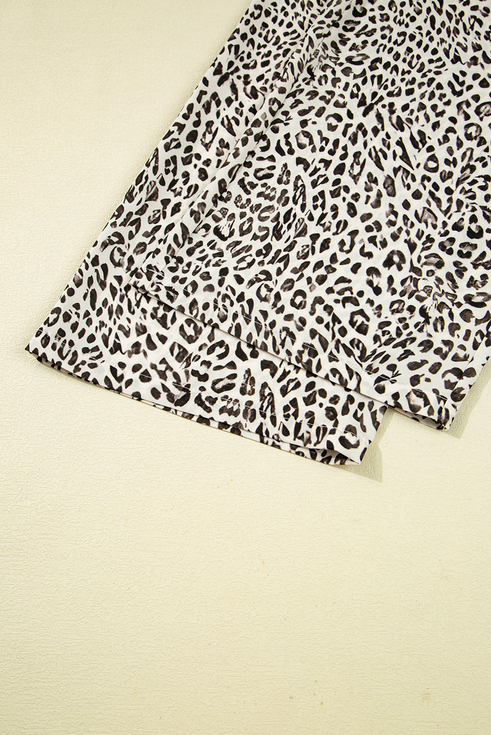 Leopard print fabric on a beige background