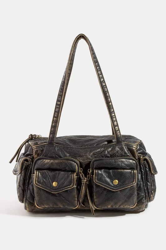 Black leather handbag with gold accents on a white background