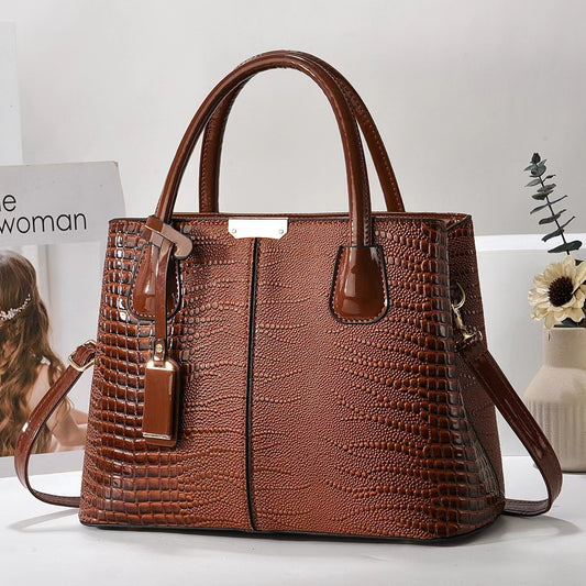 Brown textured handbag on a light background