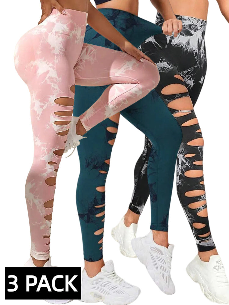 Three pairs of patterned leggings in pink, blue, and black with cut-out design on a white background.