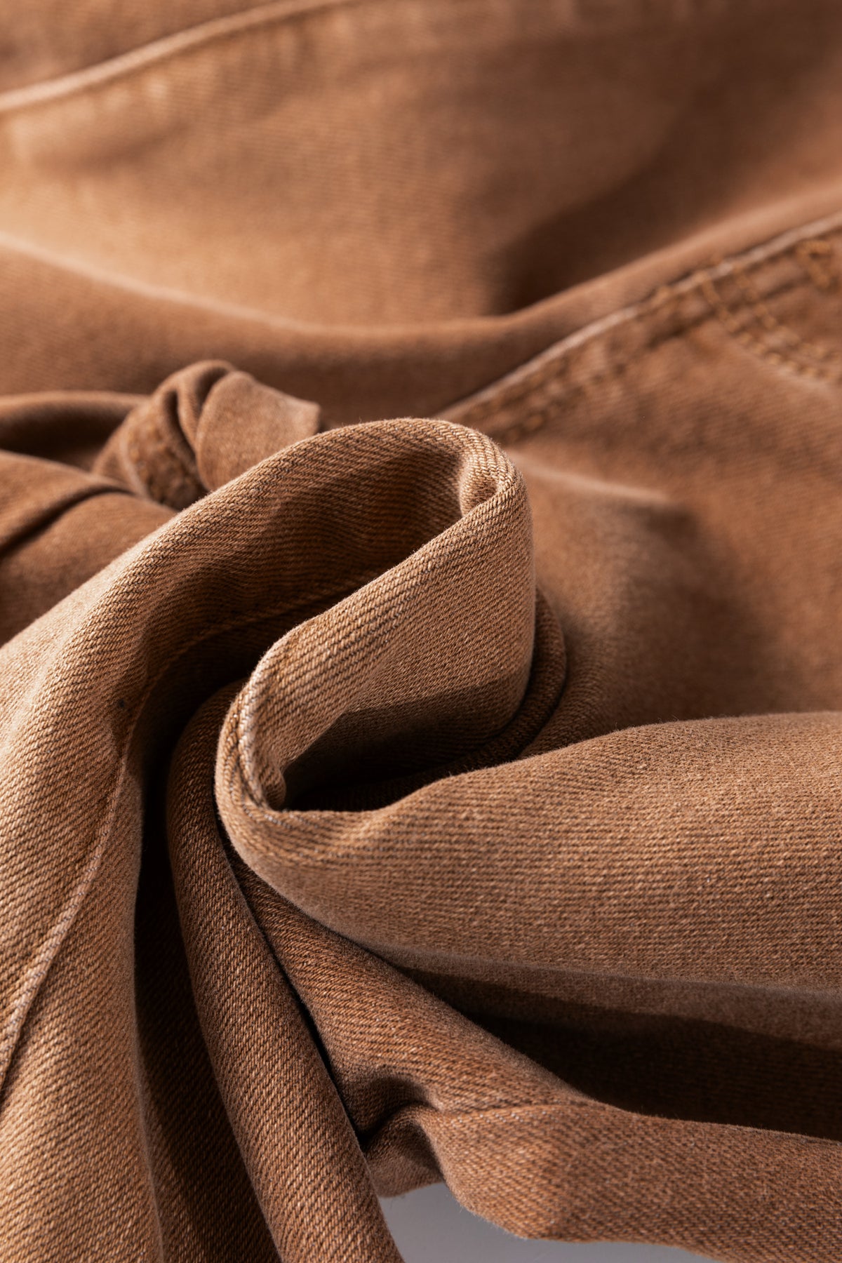 Close-up of Women's Vintage Copper High-Waist Jeans fabric