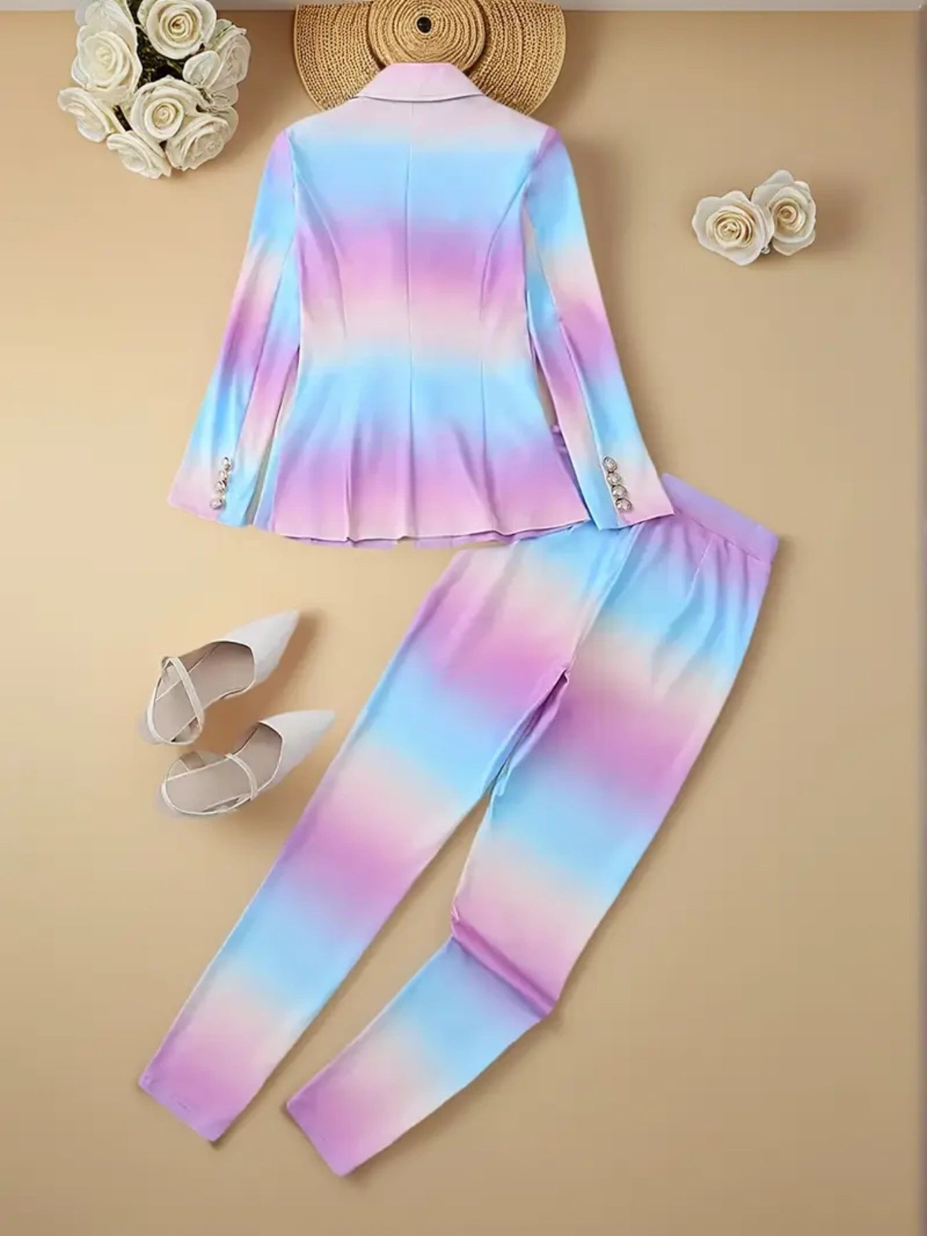 Colorful tie-dye outfit with a top and pants on a beige background