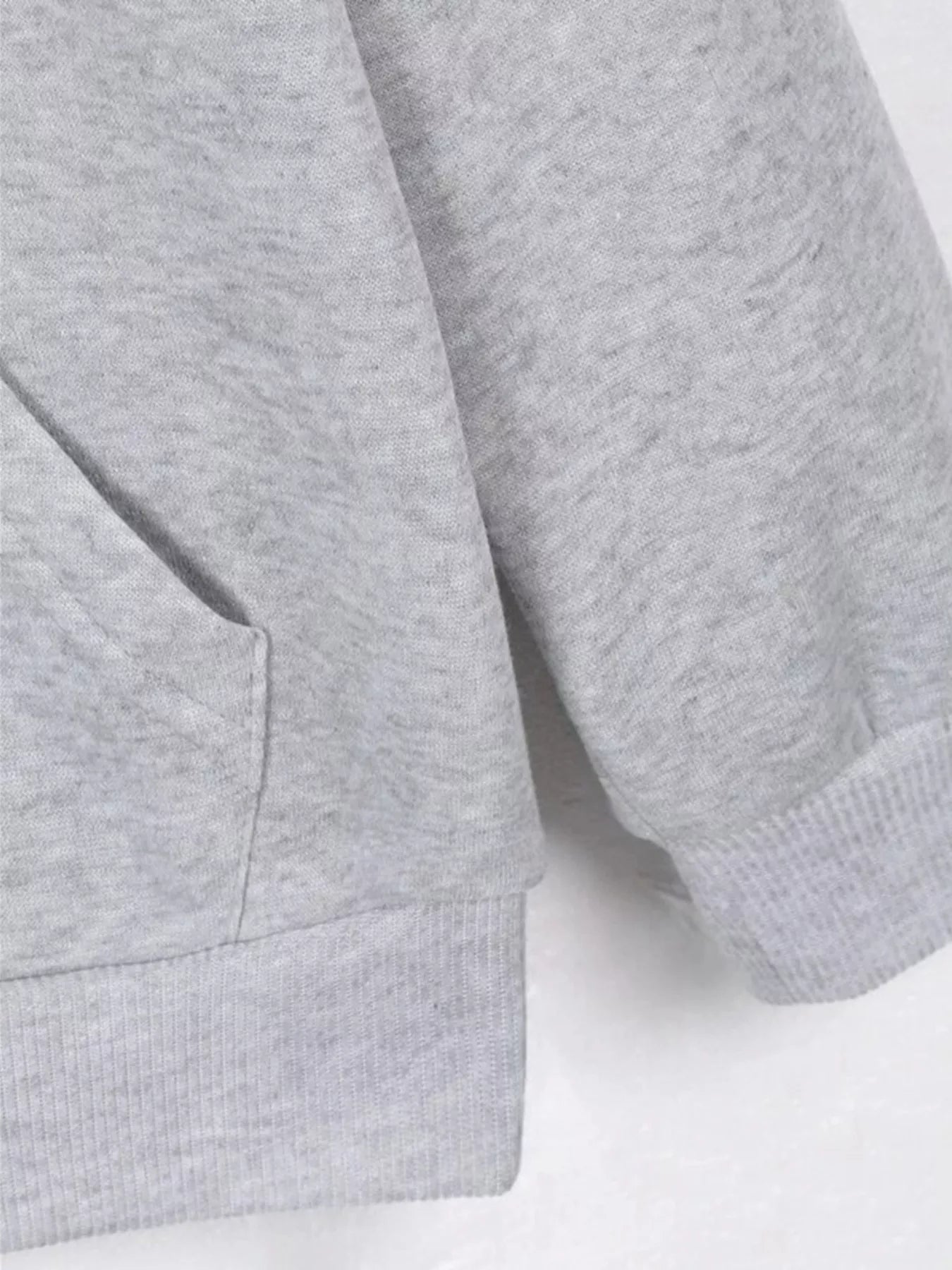 Close-up of a gray hoodie on a white background