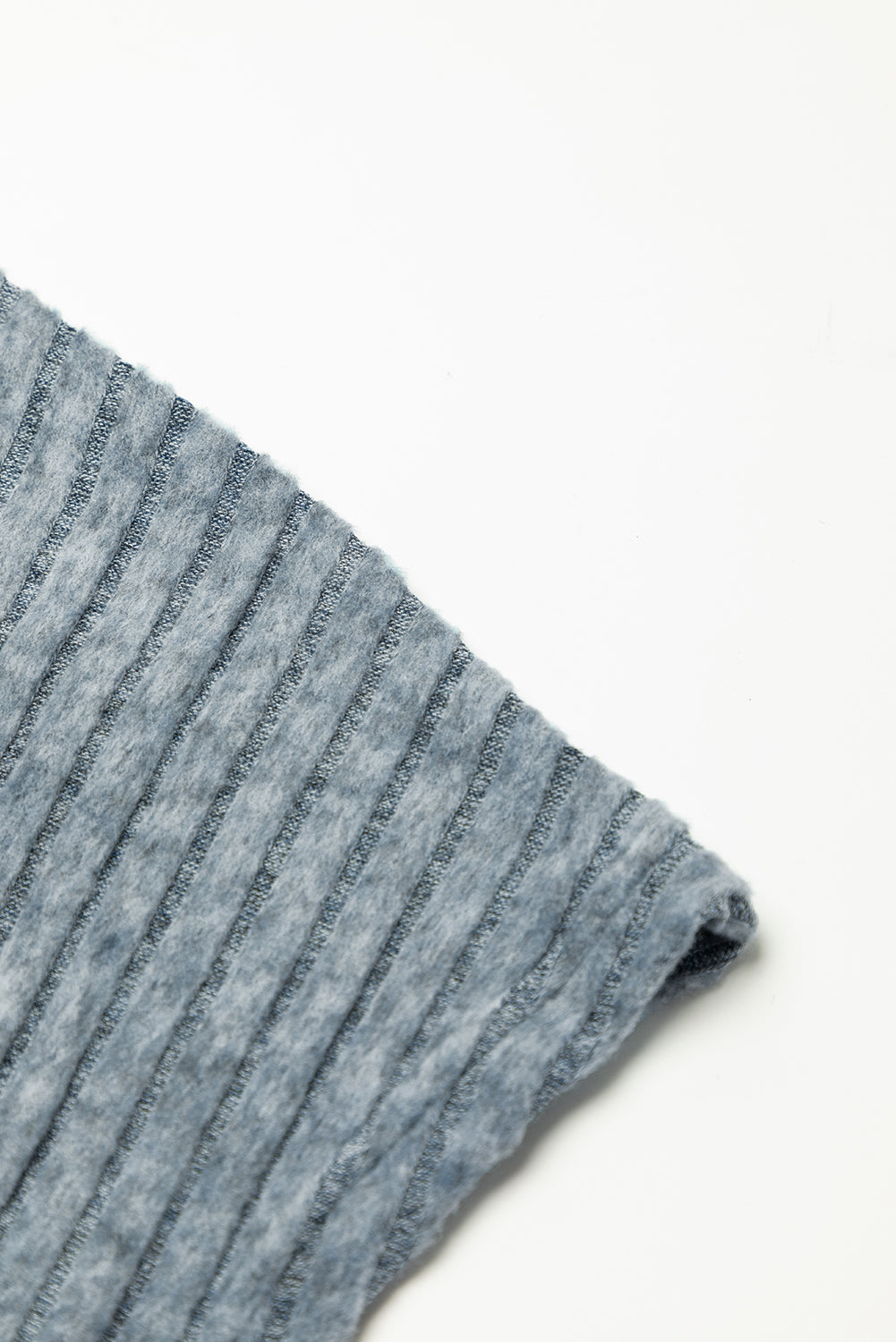 Close-up of a blue and gray striped fabric on a white background