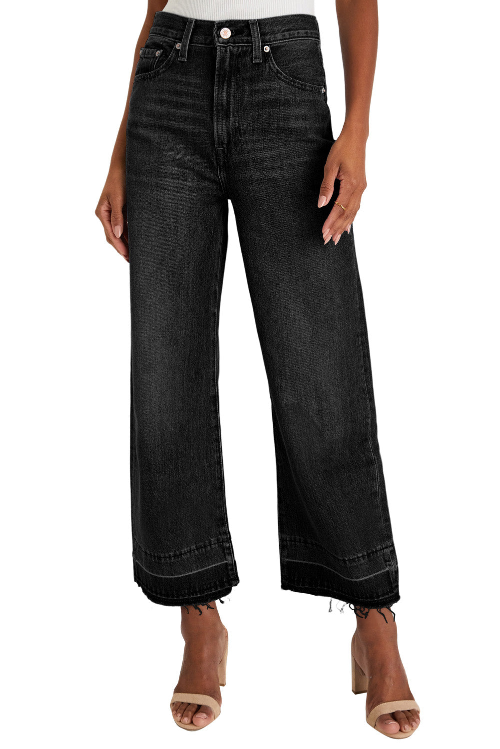 Black wide-leg jeans worn by a person on a white background