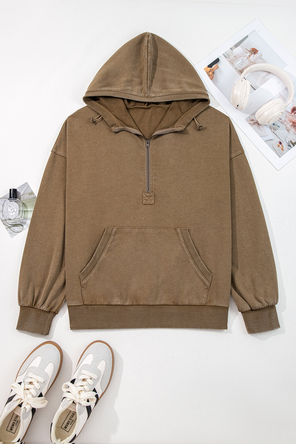 Brown hoodie with a zipper on a white background