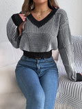 Black patchwork stripe V‑neck cropped sweater, front view — BUhmayzing