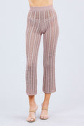 Knitted Blush pink pants worn by a person on a light gray background