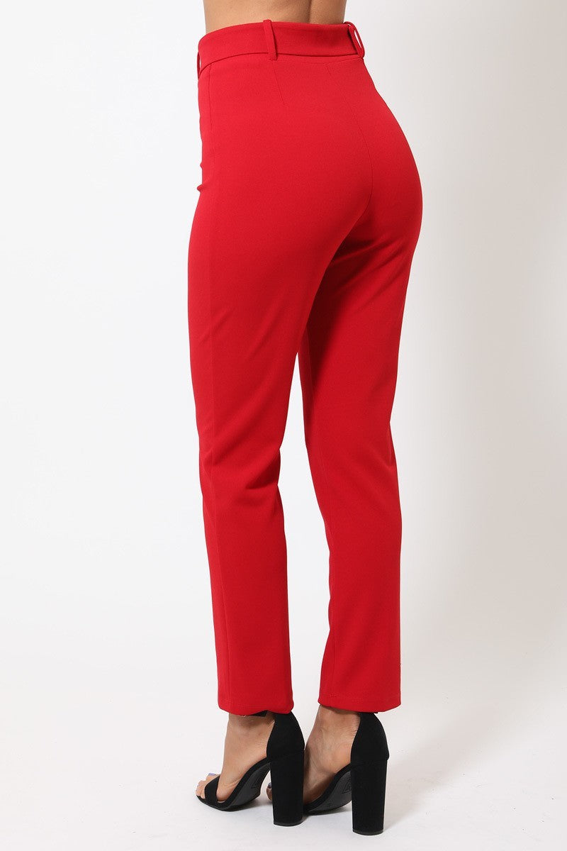 Red pants worn by a person on a white background rear fit view