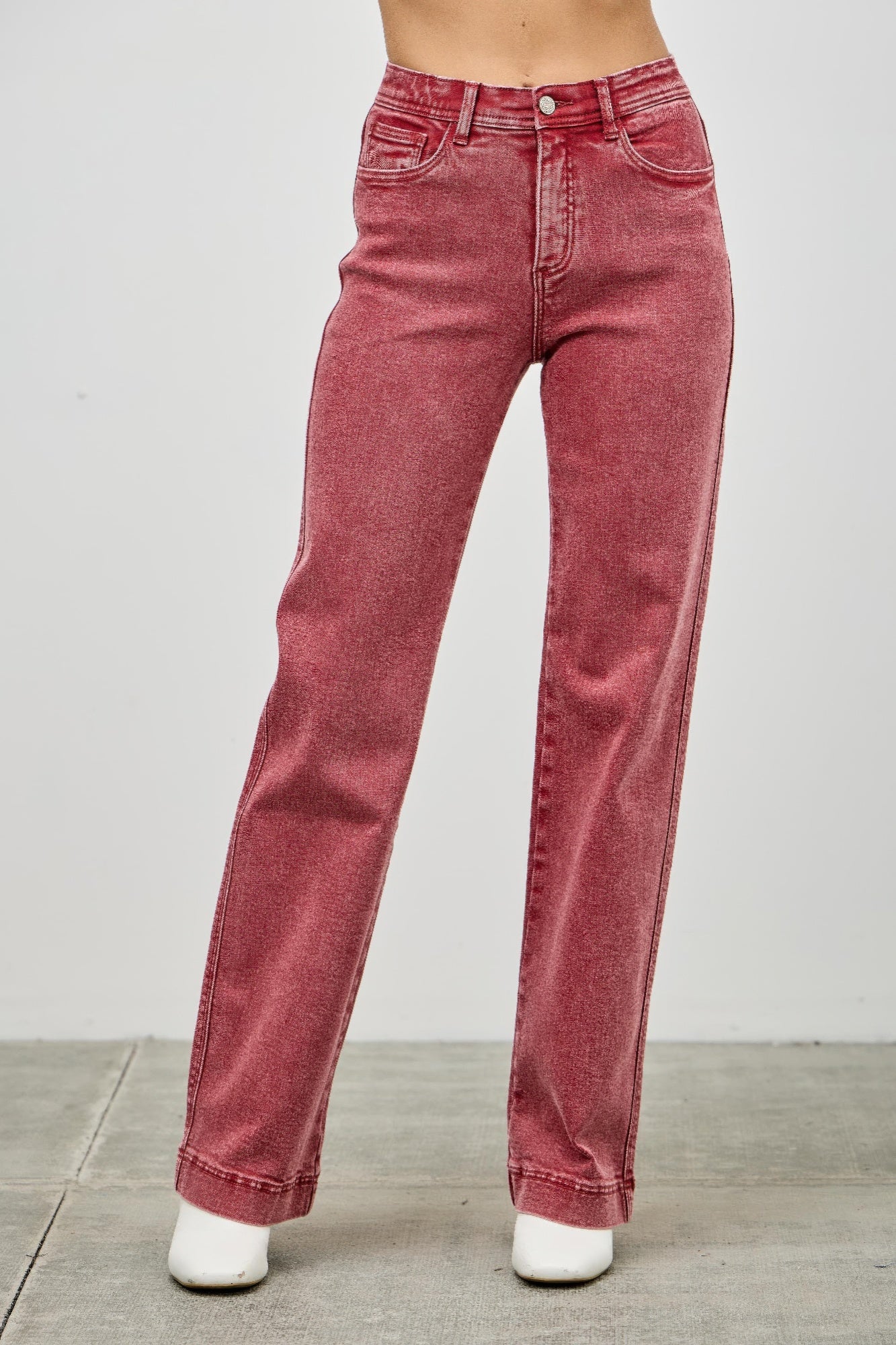 Red jeans worn by a person 