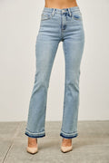 Light blue jeans worn by a person on a plain background