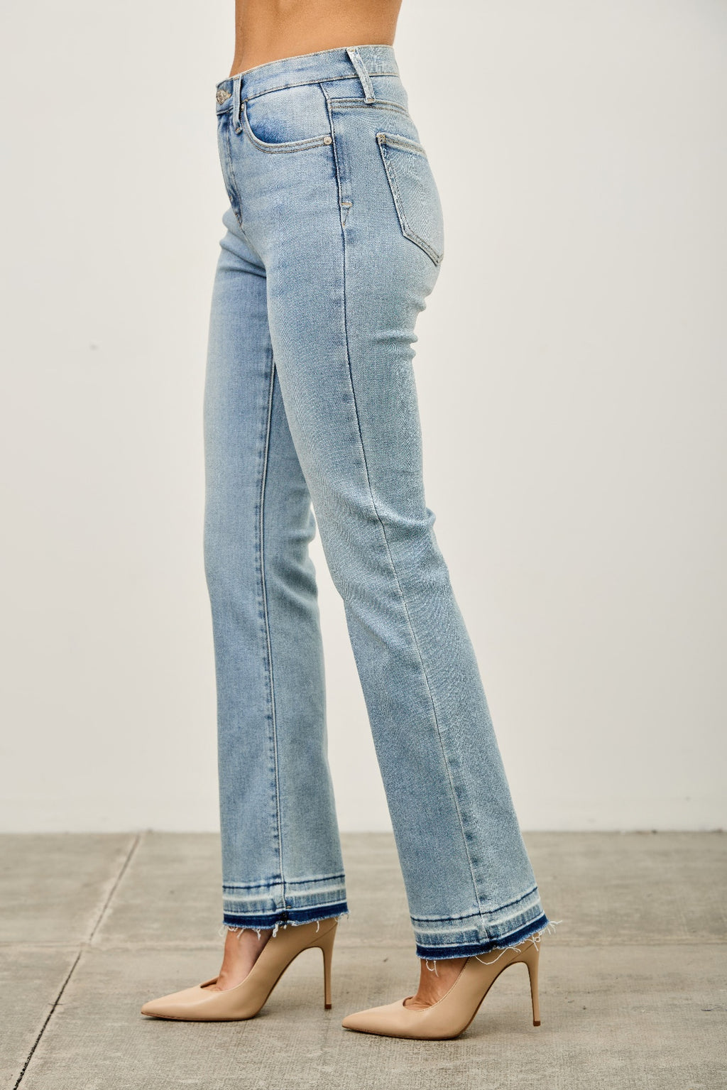Light blue jeans worn by a person side view