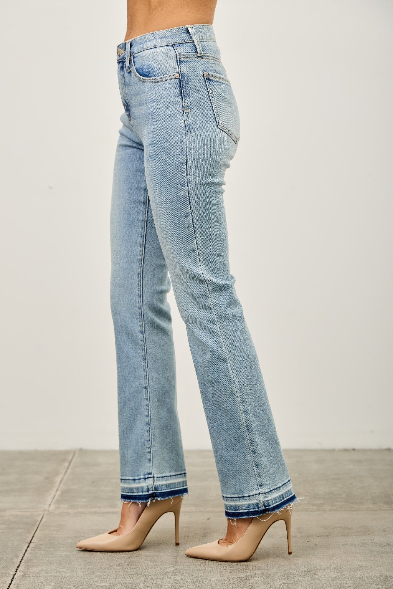 Light blue jeans worn by a person side view