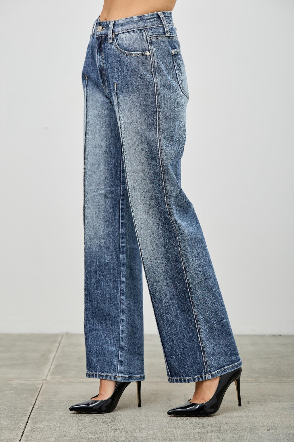 Pintuck Blue jeans worn by a person angle view 