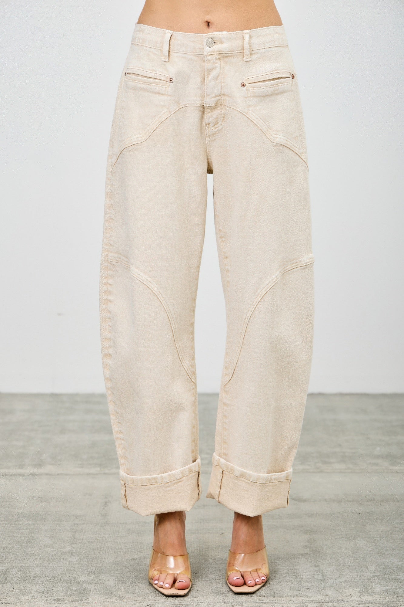 Beige Western barrel jeans worn by a model